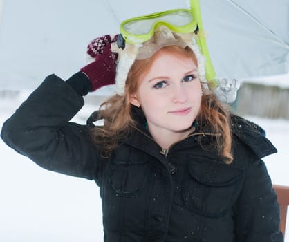 Concept photo of young girl with mask, fins and snorkel