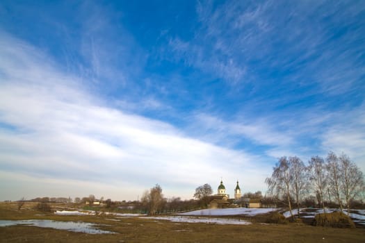 view series: rural early spring landscape with church