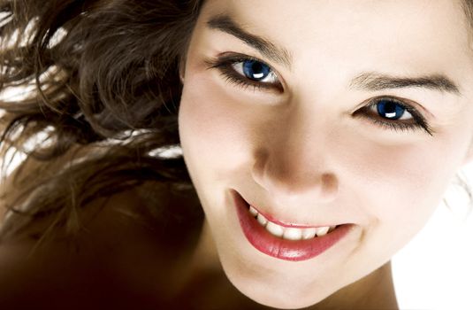 Portrait of a young woman with beautiful blue eyes smiling