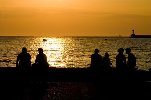 leisure series: people silhouettes on the sea beach