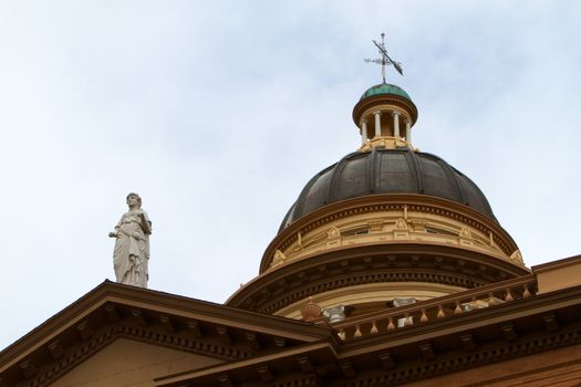 Copper and bronze domes of courthouse building with Themis statue
