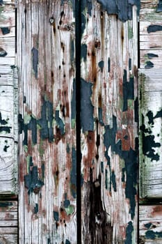 Close up view a wooden texture with peeled paint.