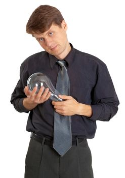 A man keeps on hand a large light bulb on white