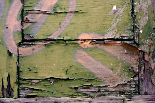 Close up view a wooden texture with peeled paint.