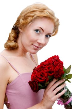 Retro looking red head woman with bunch of roses