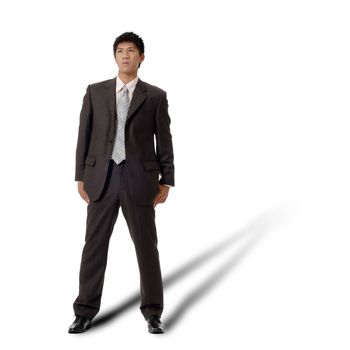 Lonely business man standing, full length portrait isolated on white background.