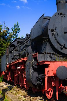 A steam locomotive standing at a station