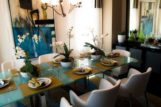 Modern flashy dining room with place settings on table