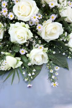 a rose bouquet with white roses and decoration