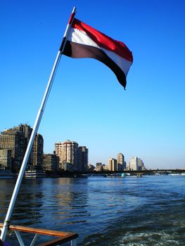 flag on a boat on river nile