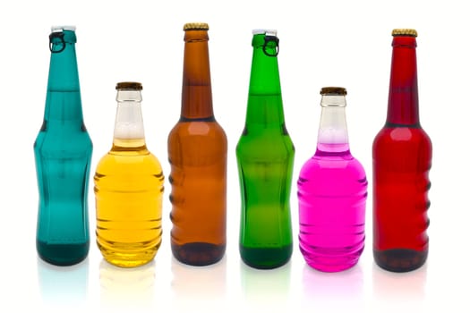 row of multicolored beer bottles over white background