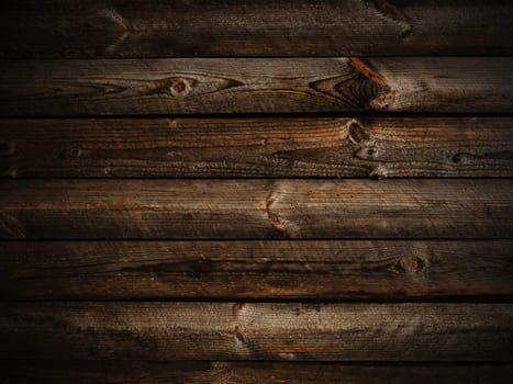 Photo of horizontal abstract dark wooden background with light 