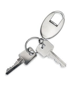 metal key with trinket over white background