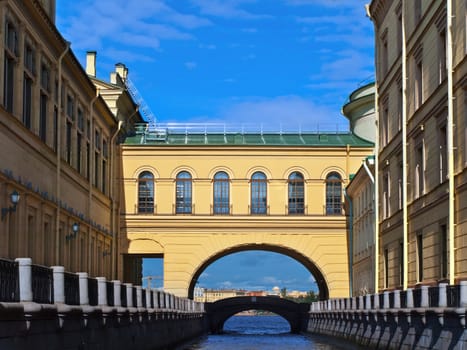 view of the city with architectural arch and water channel