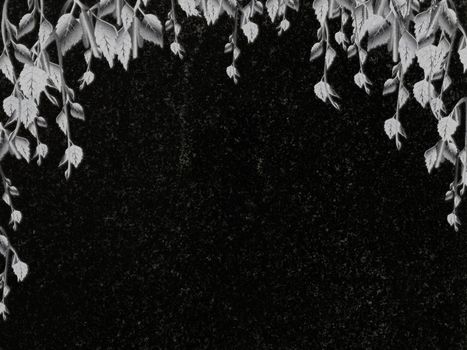 birch decoration at black granite gravestone, copyspace 