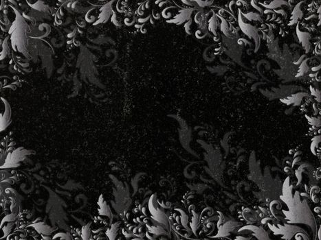 floral decoration at black granite gravestone, copyspace 
