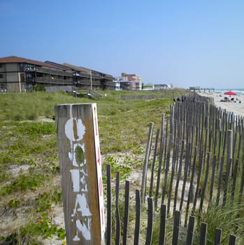 A sign at the beach showning the end of road