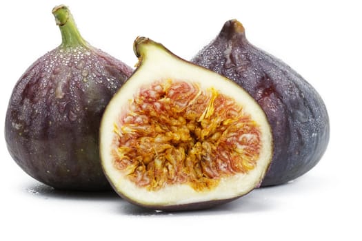 two and a half wet figs on white background