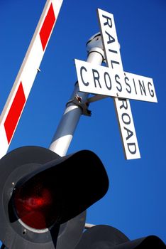 Rail Road Crossing Sign Against a Clear Blue Sky