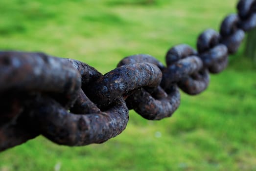 Close up shot of an old rusted chain