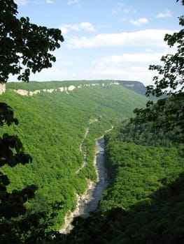 Greens; the Caucasian ridge; rocks; a relief; a landscape; a hill; a panorama; mountains; Caucasus; mountain; a slope