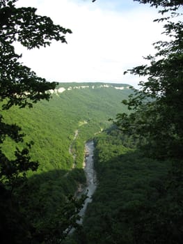 Greens; the Caucasian ridge; rocks; a relief; a landscape; a hill; a panorama; mountains; Caucasus; mountain; a slope