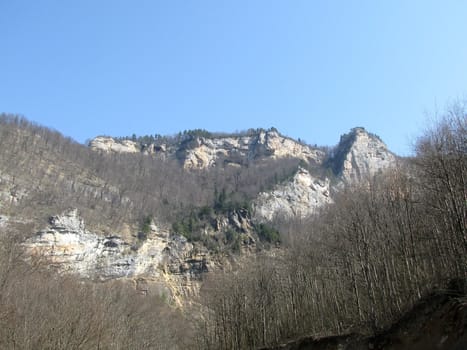 Greens; the Caucasian ridge; rocks; a relief; a landscape; a hill; a panorama; mountains; Caucasus; mountain; a slope