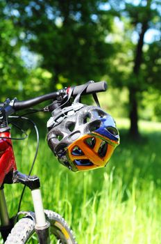 mountain bike with helmet showing safety or sports concept in nature