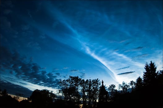 Silver clouds. An unusual occurrence around the white nights. Very high clouds are shone silver light against the night summer sky.