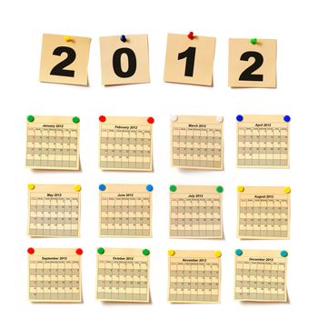 calendar on set note 2012. Paper a note attached to a wall buttons, it is isolated on a white background