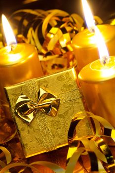 Christmas candles and gift boxes. Gold color