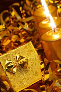 Christmas candles and gift boxes. Gold color