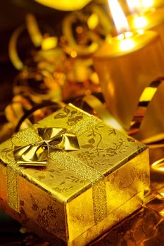 Christmas candles and gift boxes. Gold color