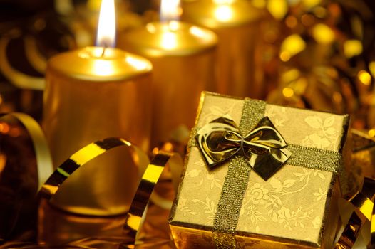 Christmas candles and gift boxes. Gold color