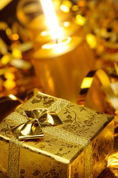 Christmas candles and gift boxes. Gold color