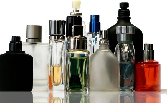 Fragrances bottles with reflection - no trademark visible.