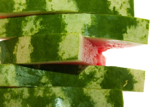 Stack of five pieces of watermelon isolated over white.