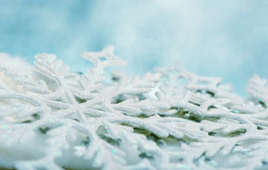 Snowflake big close up. Bokeh a background. Toning is blue