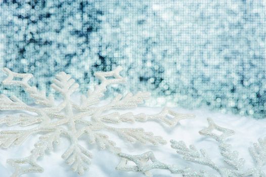 Snowflake big close up. Bokeh a background. Toning is blue