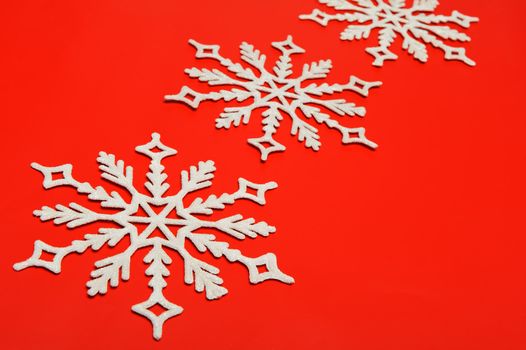 The big snowflake on a red background. Closeup