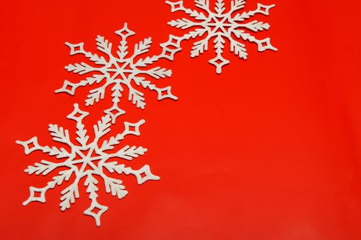 The big snowflake on a red background. Closeup