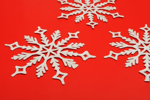 The big snowflake on a red background. Closeup