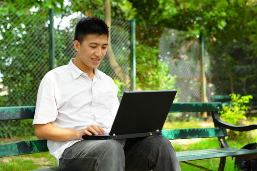 man using computer outdoor