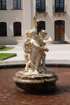 fountain in front of baroque palace in poland
