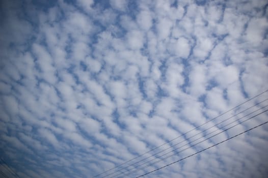 white cirrocumulus clouds on beautiful blue sky