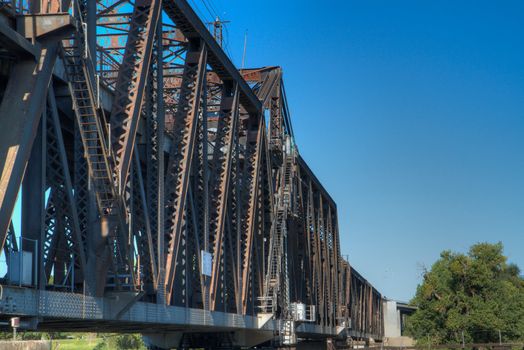 HDR tonemapped image of an old rusty train bridge