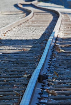 Abstract of railroad tracks with curve in distance