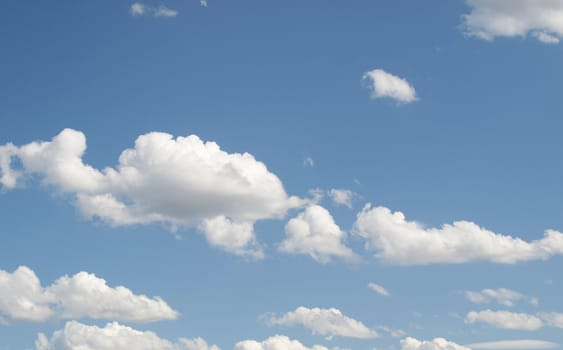 Blue sky with white clouds useful as a background