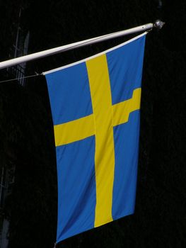 Swedish flag isolated over black background