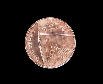 penny coin isolated over black background